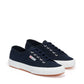 navy blue canvas sneakers with white rubber outer sole slight top view
