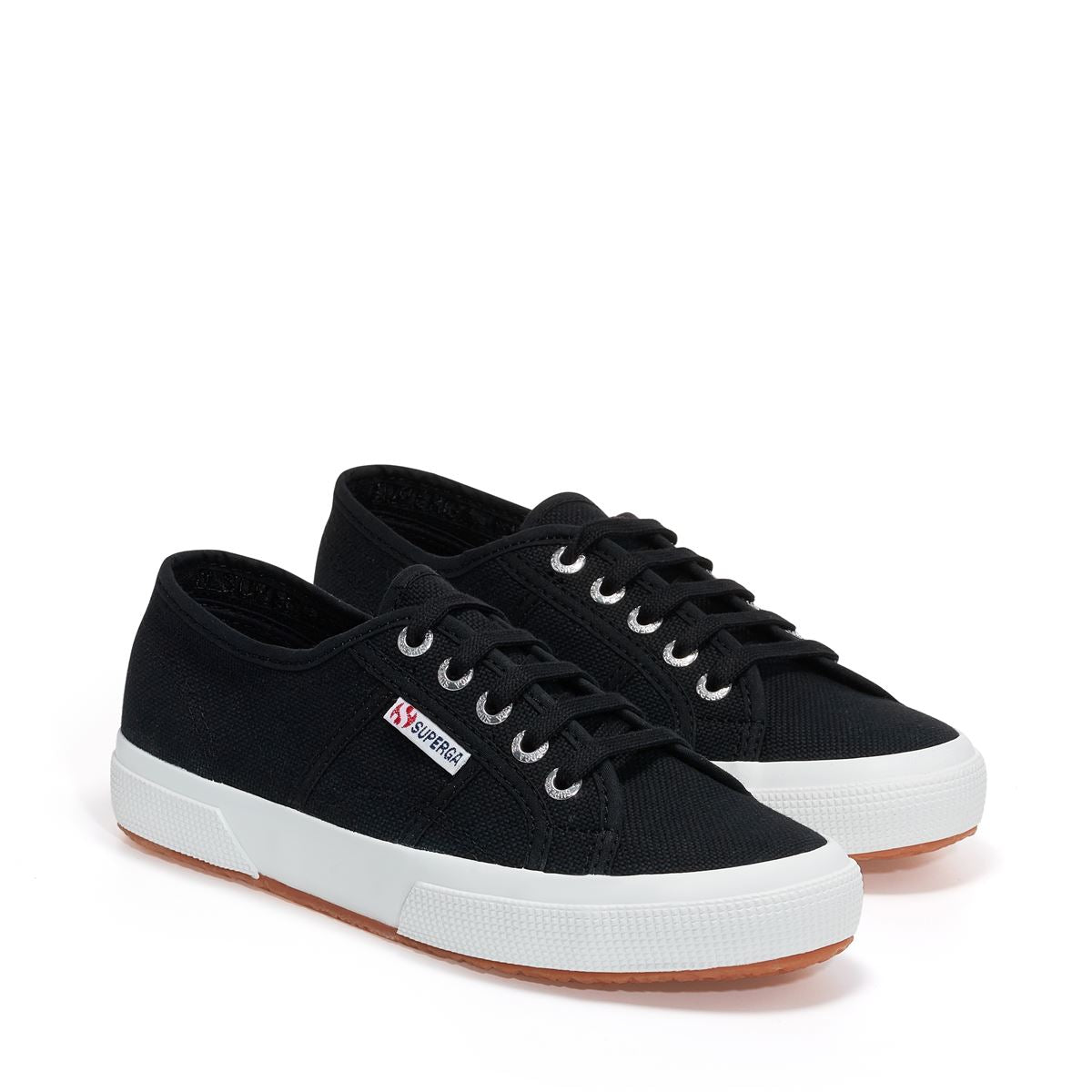 pair of navy canvas Superga shoes slight top angle