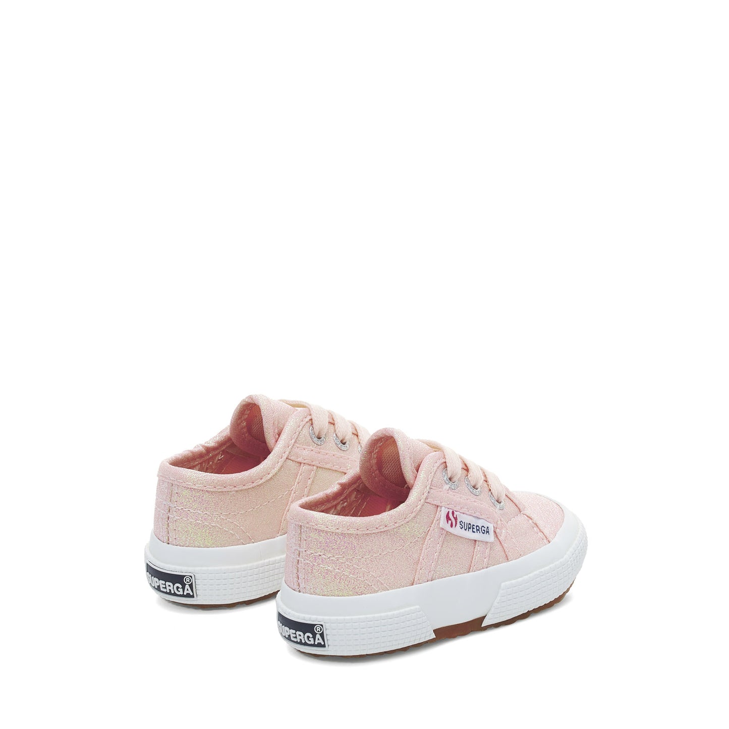 baby Superga shoes in pastel peach colour and white rubber soles slight back view