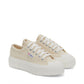 pair of cream canvas Superga sneakers with white platform outer sole slight top view