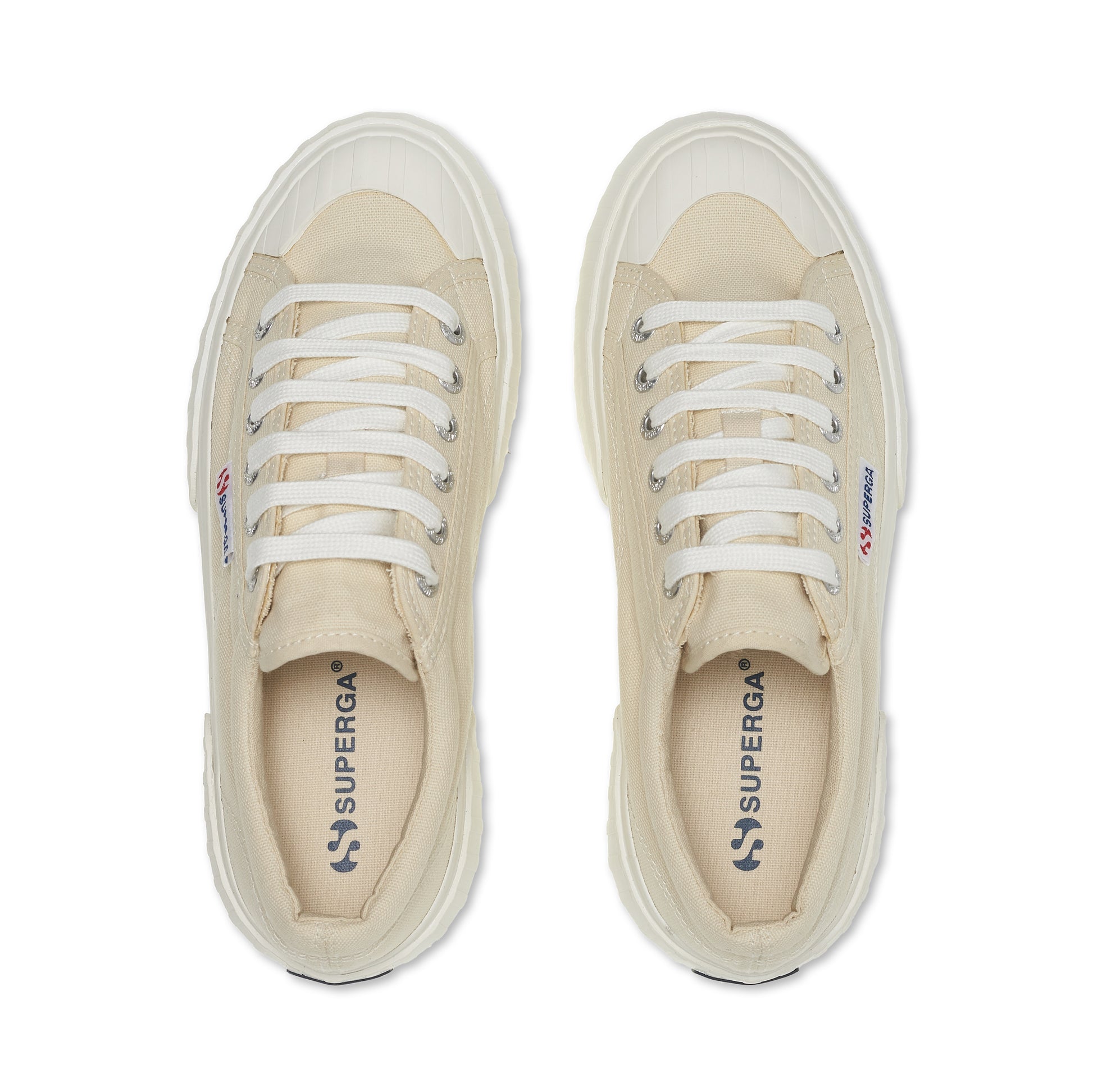 pair of cream canvas Superga sneakers with white platform outer sole top view