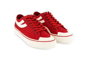 pair of red Superga shoes with rubber outer and white stripes