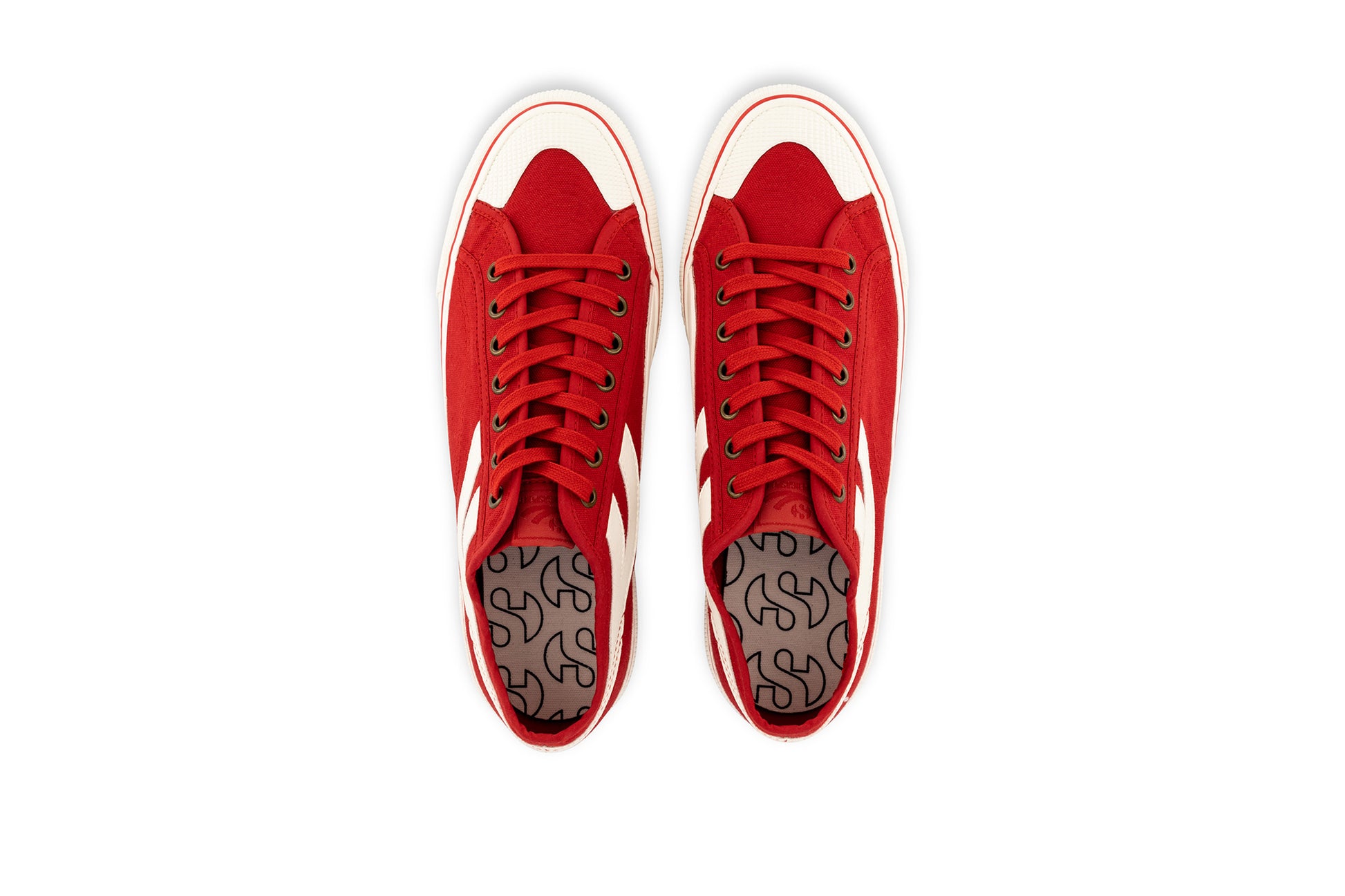 pair of red Superga shoes with rubber outer and white stripes top view